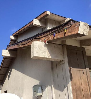 A damaged roof with a warning sign indicating potential hazards or repairs needed.
