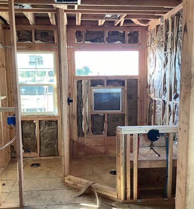 A bathroom featuring a window and a sink, with natural light illuminating the space.